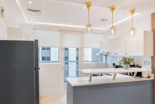 Modern bright lit kitchen with a balcony view